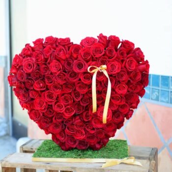 Heart-shaped standing arrangement of fresh red roses for romantic occasions in Lagos.